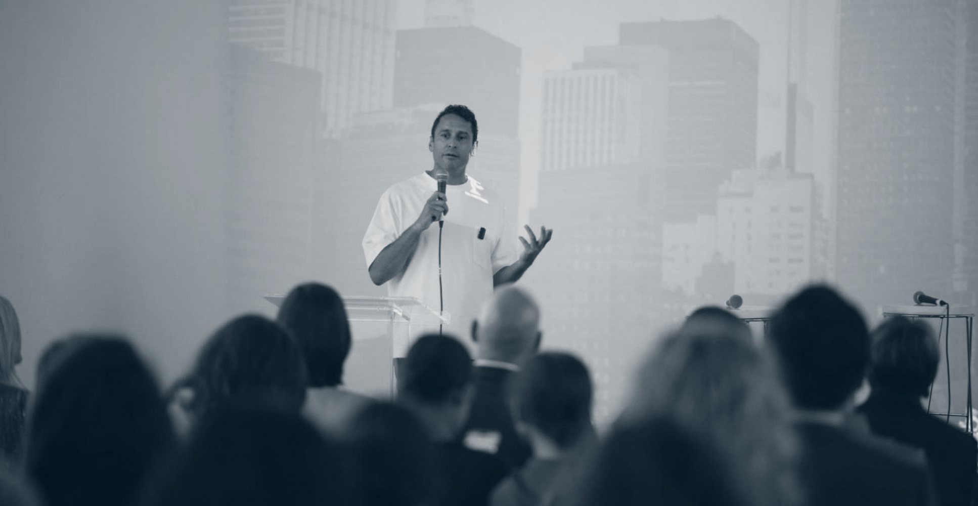 Morad Fareed speaking to an audience in New York